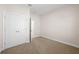 Carpeted bedroom with a view into another room at 5807 Silver Sun Dr, Apollo Beach, FL 33572