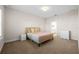 Cozy bedroom featuring neutral tones, carpet flooring, and comfortable bed at 5807 Silver Sun Dr, Apollo Beach, FL 33572