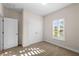 Cozy bedroom with a window and natural light, alongside a closet with white double doors at 5807 Silver Sun Dr, Apollo Beach, FL 33572