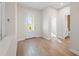 Entryway foyer with wood-look tile flooring and an entry door at 5807 Silver Sun Dr, Apollo Beach, FL 33572