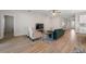 Inviting living room with wood floors, ceiling fan, comfortable seating and ample space at 5807 Silver Sun Dr, Apollo Beach, FL 33572