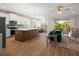 Open-concept living space with a modern kitchen, dining area, and cozy seating area, creating an inviting atmosphere at 5807 Silver Sun Dr, Apollo Beach, FL 33572