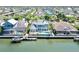 Aerial view of the beautiful home on the water with a dock, boat and swimming pool at 615 Islebay Dr, Apollo Beach, FL 33572