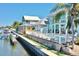 View of the back of the home from the water showing the dock, pool and boat lift at 615 Islebay Dr, Apollo Beach, FL 33572