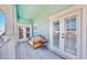 Cozy balcony seating area offers a relaxing view at 615 Islebay Dr, Apollo Beach, FL 33572