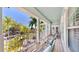 Relaxing upper-level balcony overlooking lush landscaping and neighborhood views at 615 Islebay Dr, Apollo Beach, FL 33572