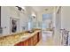 Bright bathroom showcasing double granite vanity with and sinks and large walk-in closet at 615 Islebay Dr, Apollo Beach, FL 33572