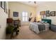 Bedroom featuring a full bed, ceiling fan, plantation shutters, and lots of decor at 615 Islebay Dr, Apollo Beach, FL 33572