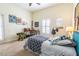 Bright bedroom with a full bed, ceiling fan, plantation shutters, and lots of nautical decor at 615 Islebay Dr, Apollo Beach, FL 33572