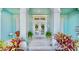 Inviting front porch with potted plants, stepping stones, and views of the front door at 615 Islebay Dr, Apollo Beach, FL 33572