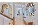 Hallway showcasing beautiful decor, with a bench and stairway at 615 Islebay Dr, Apollo Beach, FL 33572