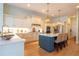 Modern kitchen featuring custom cabinets, counter seating, and stainless steel appliances at 615 Islebay Dr, Apollo Beach, FL 33572