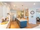 Bright kitchen featuring a large island, stainless steel appliances, and custom cabinetry with white countertops at 615 Islebay Dr, Apollo Beach, FL 33572