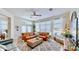 Inviting living room with a large leather sectional, stylish decor, and plenty of natural light at 615 Islebay Dr, Apollo Beach, FL 33572