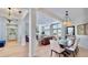 Bright, open-concept living and dining area with hardwood floors and stylish decor at 615 Islebay Dr, Apollo Beach, FL 33572