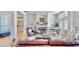 Cozy living room featuring a fireplace, piano, and comfortable seating area at 615 Islebay Dr, Apollo Beach, FL 33572