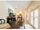 Spacious living room featuring French doors, natural light, and comfortable seating with TV at 615 Islebay Dr, Apollo Beach, FL 33572