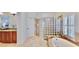 Well-lit primary bathroom with a glass block shower and separate soaking tub at 615 Islebay Dr, Apollo Beach, FL 33572