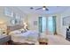 Comfortable primary bedroom boasts hardwood floors, a ceiling fan, and neutral colors at 615 Islebay Dr, Apollo Beach, FL 33572
