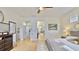 Spacious primary bedroom with natural light, hardwood floors, and ceiling fan at 615 Islebay Dr, Apollo Beach, FL 33572