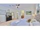 Bright primary bedroom shows hallway and ensuite bathroom at 615 Islebay Dr, Apollo Beach, FL 33572