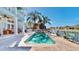 Inviting in-ground pool, poolside seating, and lush landscaping complete this outdoor oasis at 615 Islebay Dr, Apollo Beach, FL 33572