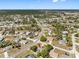 Bird's eye view of property in established neighborhood with mature trees and nearby amenities at 6242 Gainsboro Ave, Spring Hill, FL 34609