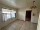 Inviting dining room with tiled floor, window, and chandelier at 6411 N 34Th St, Tampa, FL 33610