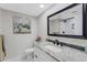 Bathroom featuring updated vanity with granite countertop and walk-in shower at 7623 Radcliffe Cir # A101, Port Richey, FL 34668
