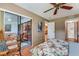 Bright bedroom with sliding glass doors leading to a cozy screened-in porch at 7623 Radcliffe Cir # A101, Port Richey, FL 34668