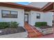 Charming front entrance with bright paint, manicured landscaping, and unit number 101 at 7623 Radcliffe Cir # A101, Port Richey, FL 34668