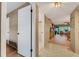 Hallway leading to the main living area and bathroom at 7623 Radcliffe Cir # A101, Port Richey, FL 34668