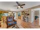 Inviting living space with coastal decor, wicker furniture, and an open layout to the dining area at 7623 Radcliffe Cir # A101, Port Richey, FL 34668