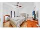 Bright bedroom featuring hardwood floors, neutral decor, and plenty of natural light at 7853 Bristol Park Dr, Apollo Beach, FL 33572