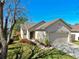 Single story home with a well-manicured lawn and two-car garage at 7853 Bristol Park Dr, Apollo Beach, FL 33572