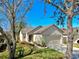 Charming single-story home boasts a well-maintained lawn and a two-car garage at 7853 Bristol Park Dr, Apollo Beach, FL 33572