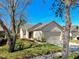 Charming single-story home with a well-manicured lawn and two-car garage at 7853 Bristol Park Dr, Apollo Beach, FL 33572