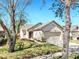 Charming single-story home with a well-manicured lawn and two-car garage at 7853 Bristol Park Dr, Apollo Beach, FL 33572