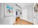 Hallway with lovely decor and wood-look flooring at 7853 Bristol Park Dr, Apollo Beach, FL 33572