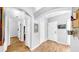 Hallway featuring archway, wood-look flooring, and neutral paint at 7853 Bristol Park Dr, Apollo Beach, FL 33572