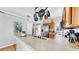 Kitchen with stainless steel appliances, hanging pot rack, and stone countertops at 7853 Bristol Park Dr, Apollo Beach, FL 33572