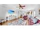 Open-concept living room boasts stylish furnishings and a ceiling fan at 7853 Bristol Park Dr, Apollo Beach, FL 33572