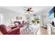 Comfortable living room featuring a ceiling fan and sliding glass doors to the backyard at 7853 Bristol Park Dr, Apollo Beach, FL 33572