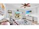 Comfortable living room with ceiling fan, decorative rug, and sliding glass doors to patio at 7853 Bristol Park Dr, Apollo Beach, FL 33572