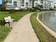 Scenic walkway with bench seating, perfect for enjoying serene water views and leisurely strolls at 7867 Sailboat Key Blvd S # 201, South Pasadena, FL 33707