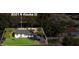 Aerial view of the house and property with outline boundary, house, lawn, and driveway at 8501 N Alaska St, Tampa, FL 33604