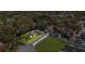 Aerial view of property with outlined boundaries, house, lawn, and landscaping at 8501 N Alaska St, Tampa, FL 33604