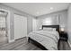 A peaceful bedroom features a bed, closet, and natural light, creating a cozy and inviting atmosphere at 8501 N Alaska St, Tampa, FL 33604