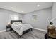 Cozy bedroom featuring a comfortable bed, soft lighting, and neutral decor for a relaxing atmosphere at 8501 N Alaska St, Tampa, FL 33604