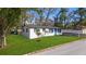 Home exterior with well maintained yard at 8501 N Alaska St, Tampa, FL 33604